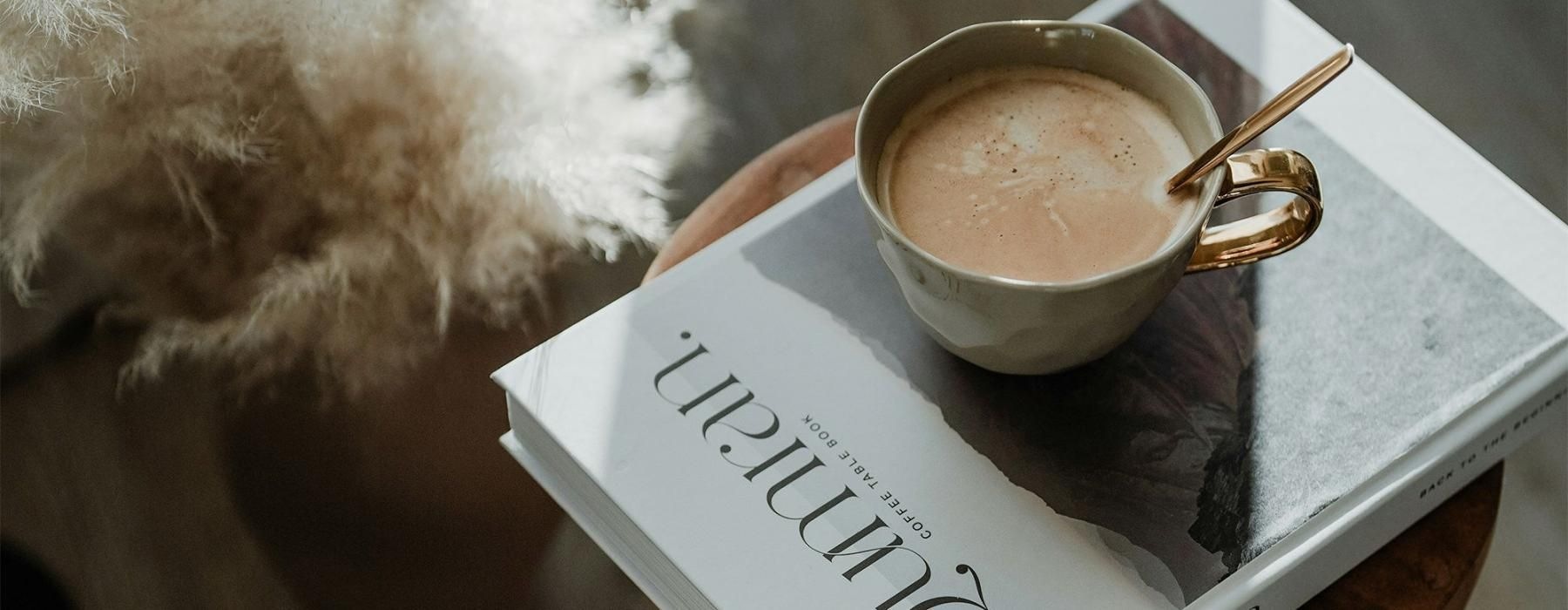 a cup of coffee on a book